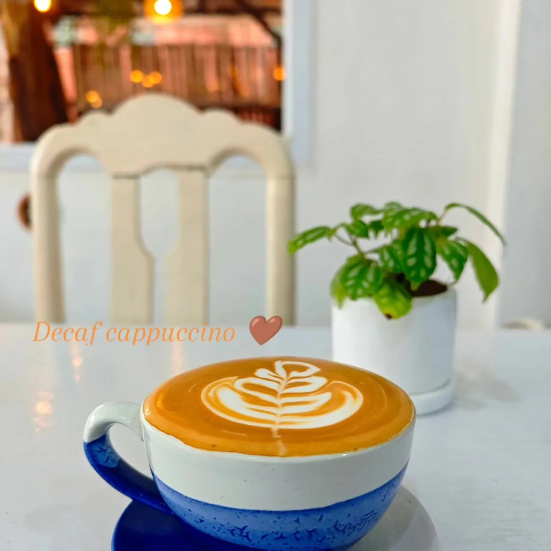 Decaf cappuccino with latte art at Mellow Submarine
