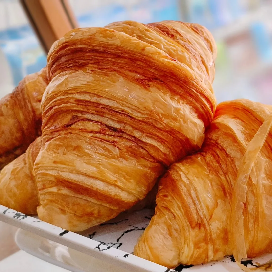 Golden flaky croissants baked fresh every morning