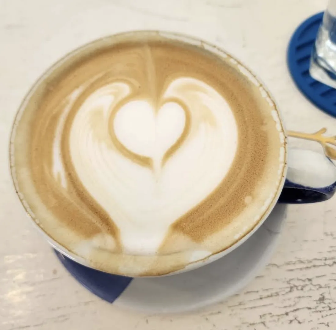 Coffee with heart latte art at Mellow Submarine
